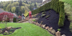 installation of blown in mulch on a residential property